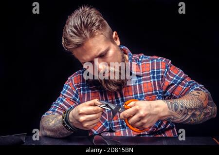 Currier creates a new leather product Stock Photo
