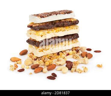 pile of energy cereal bars with nuts on white background Stock Photo