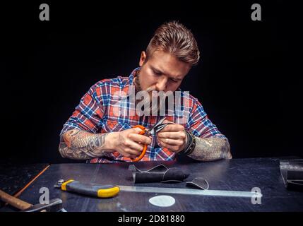 Leather man makes quality products Stock Photo