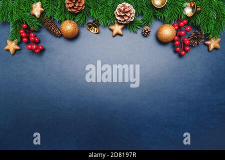 christmas pine tree with xmas decoration on blue background Stock Photo