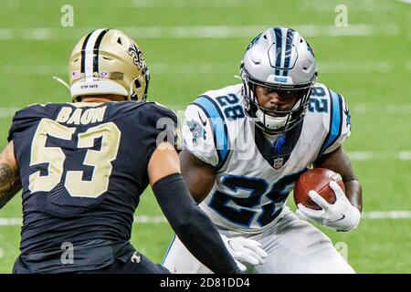 New Orleans, LOUISIANA, USA. 25th Oct, 2020. (left to right) New Orleans Saints linebacker Zack Baun tries to block Carolina Panthers running back Mike Davis in New Orleans, Louisiana USA on October 25, 2020. The Saints beat the Panthers 27 to 24. Credit: Dan Anderson/ZUMA Wire/Alamy Live News Stock Photo