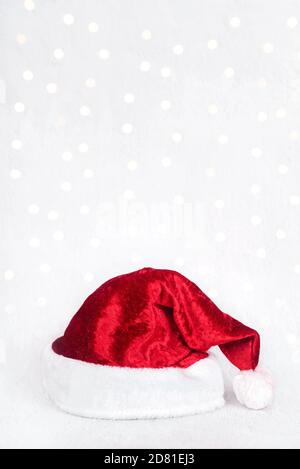 Merry Christmas.Red santa hat isolated over Christmas lights.Christmas concept background Stock Photo