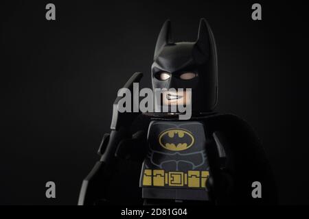 Tambov, Russian Federation - October 24, 2020 Portrait of a Lego Batman minifigure standing against a black background. Stock Photo