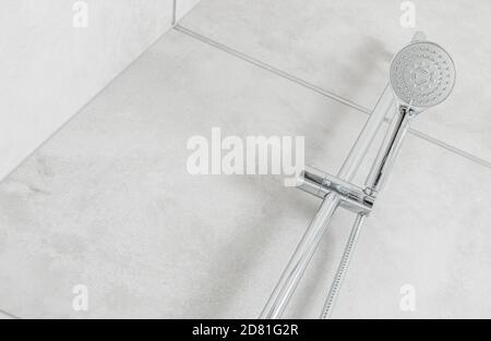 Bathroom Shower Cabin and Water Jet Head. Grey Ceramic Tiles. Clean Bathroom Interior. Stock Photo