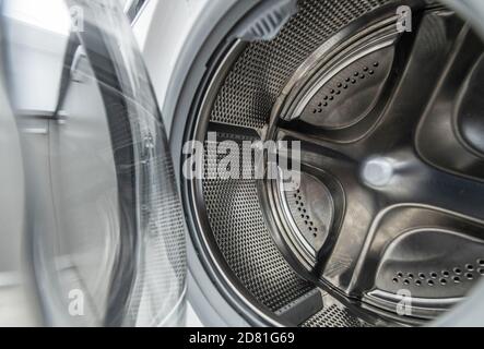 Home Appliance Used to Wash Laundry. Clean Washing Machine Drum Interior Stock Photo