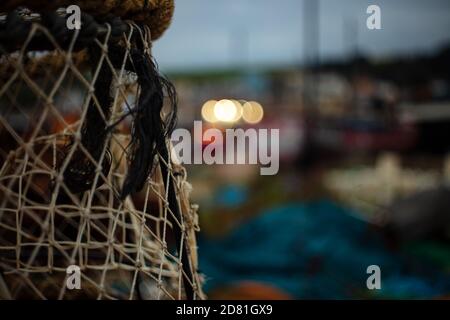 Fishing Equipment against Hastings Old Town on a Cold Autumn Evening Stock Photo