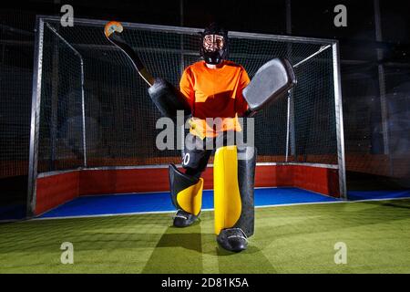 Mens field hockey goalkeeper in England coming out to warm-up Stock Photo -  Alamy