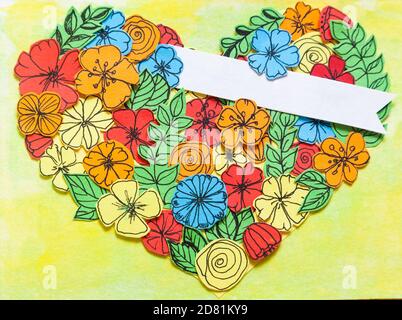 Handcrafted postcard with blank tag and cutout flowers in heart shape Stock Photo