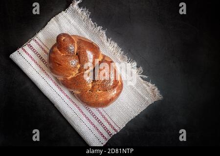 A loaf of white bread on a linen napkin Stock Photo