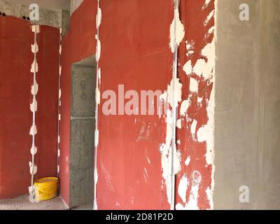 Metal screeds for plaster. Plastering interior walls Stock Photo
