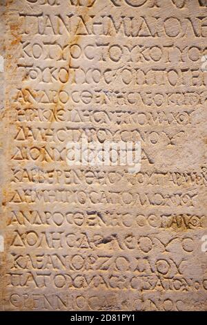 Fragment of the ancient greek letters carved on the stone Stock Photo