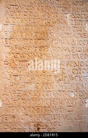 Fragment of the ancient greek letters carved on the stone Stock Photo