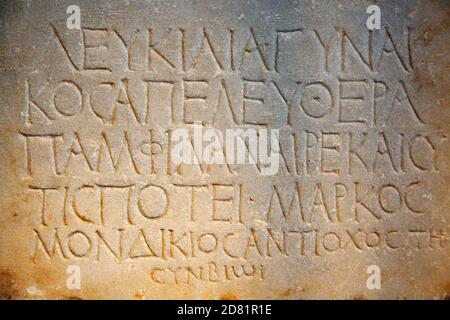 Fragment of the ancient greek letters carved on the stone Stock Photo