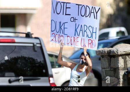 Durham, North Carolina, USA. 26th Oct, 2020. Duke University senior MARGARET CHILD of Palo Alto, CA gets out the vote on campus in Durham, NC, as students were stationed at intersections with signs directing drivers and pedestrians to on-campus polling places open for early voting which runs from October 15, 2020 to October 31, 2020 in North Carolina. Credit: Bob Karp/ZUMA Wire/Alamy Live News Stock Photo