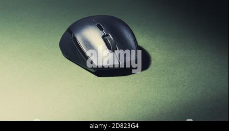 IT computer mouse on an olive green background Stock Photo