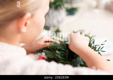 Creating Christmas floral arrangement with carnations, chrysanthemum santini flowers and fir. Floral Design basics Stock Photo