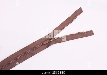 Brown zipper lock for jacket on white background isolate Stock Photo