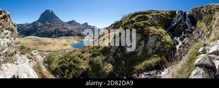 Pic du Midi d'Ossau mountain rising above the Ossau Valley, hiking around the Lac d’Ayous, iconic symbol of the French side of the Pyrenees, protected Stock Photo