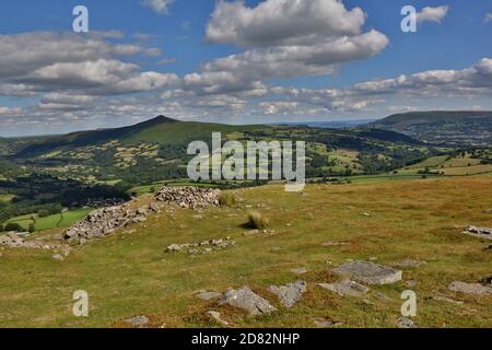 A view from the summit of Table Mountain above Crickhowell town looking towards Sugar Loaf in the Brecon Beacons, Powys, Wales. Table Mountain is a fl Stock Photo