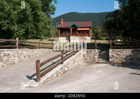 front view of log cabin in land considered the Swiss Alps of Greece Stock Photo