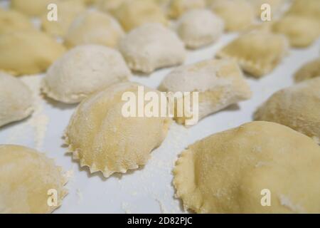 Close up view of handmade italian ravioli pasta just made at home,healthy food Stock Photo