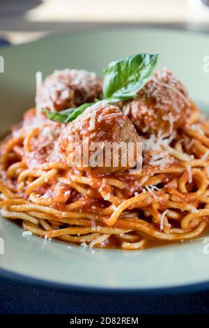 spaghetti and meatballs served in Italian Restaurant Stock Photo