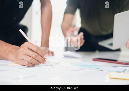 Programmer and UX UI designer working in a software development and coding technologies. Mobile and website design and programing development technolo Stock Photo