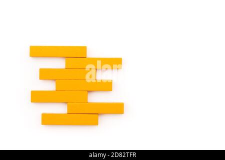 Leadership business concept. yellow wooden block stacking on white background Stock Photo