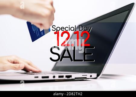 Hands holding credit card and using laptop. Online shopping Stock Photo