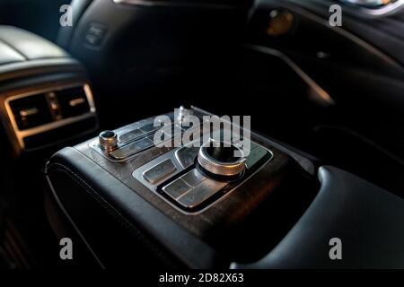 Modern luxury car central console for rear passengers Stock Photo