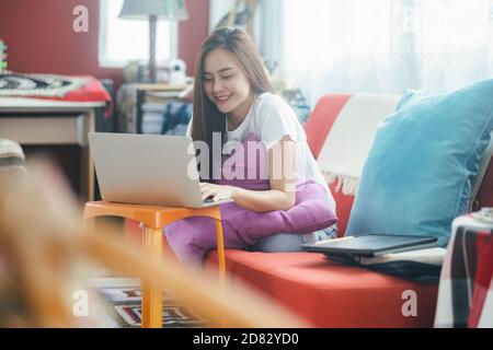 Attractive young Asia woman working at home. working and learning from home. Stock Photo