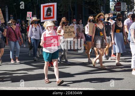 October 17, 2020. San Francisco Women's March before USA Presidential Election. Protesters holding signs. Stock Photo