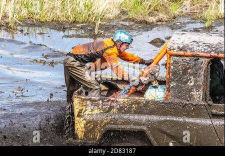 SALOVKA, RUSSIA - MAY 5, 2017: Four-wheel dirve crosses the mud obstacle on the distance of racing Stock Photo