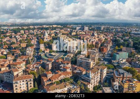 Rome cityscape aerial panorama of many buildings with orange roofs from above. Beautiful Italy city landscape.