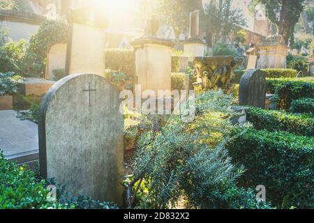 Beautiful European ancient cemetery with gravestones on sunny day. Stock Photo