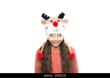 small girl in knitted reindeer hat and gloves. xmas holiday activity. child cosy sweater isolated on white. cold winter weather. warm clothes and accessory fashion for kids. happy childhood. Stock Photo