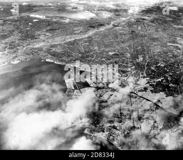 Aerial photo of Tokyo showing effects of first large-scale incendiary bombing attack by U.S. 20th Air Force operations, 1945 Stock Photo