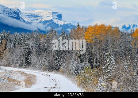 A landscape image of the first snowfall of the season on the rocky mountains in Jasper National Park in Alberta Canada. Stock Photo