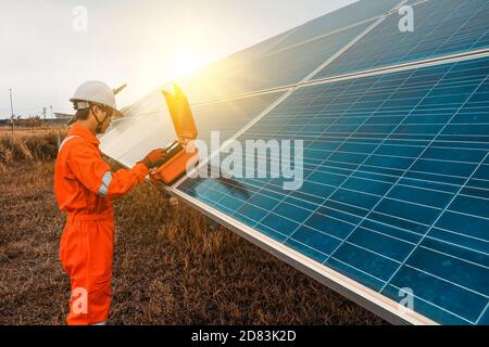 Engineers used a tool for checking the performance of the solar panel to confirming systems working normally. Photovoltaic module idea for clean energ Stock Photo