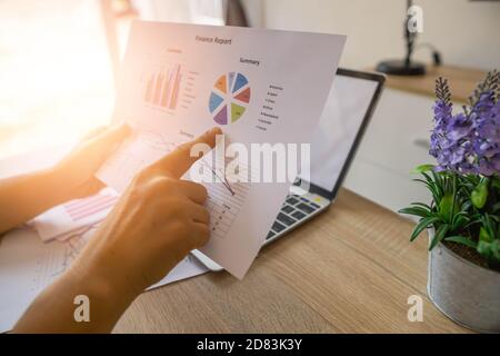 Business Financing Accounting Banking Concept, businesswoman doing finances and analyze about cost to real estate investment and in other, tax system. Stock Photo