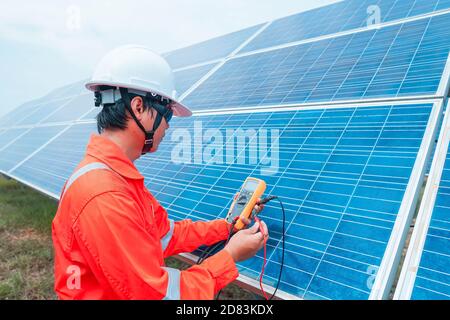 Engineers used a tool for checking the performance of the solar panel to confirming systems working normally. Photovoltaic module idea for clean energ Stock Photo