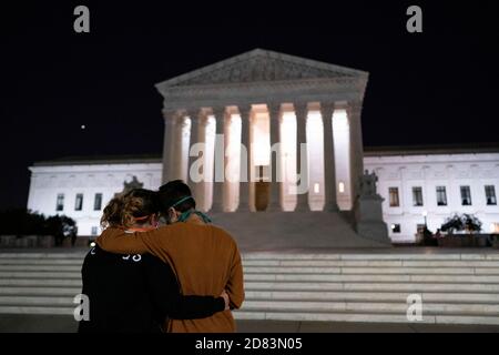 Mourners gather on the steps of the Supreme Court after the passing of US Supreme Court Justice Ruth Bader Ginsburg, in Washington, DC, on September 18, 2020. - Progressive icon and doyenne of the US Supreme Court, Ruth Bader Ginsburg, has died at the age of 87 after a battle with pancreatic cancer, the court announced on September 18, 2020 Credit: Alex Edelman/The Photo Access Stock Photo