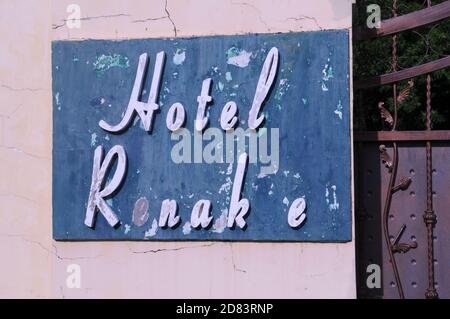 old weathered sign for the now defunct Hotel Renakse near The Royal Palace, Phnom Penh, Cambodia. credit: Kraig Lieb Stock Photo