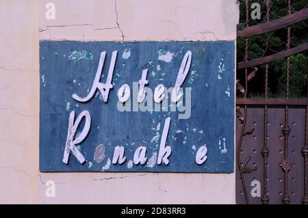 old weathered sign for the now defunct Hotel Renakse near The Royal Palace, Phnom Penh, Cambodia. credit: Kraig Lieb Stock Photo