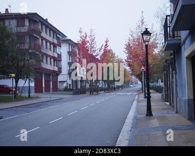 view of a street in idiazabal with colourful leafs Stock Photo