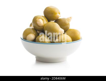 Pitted green olives stuffed with almonds in bowl  isolated on white background. Stock Photo