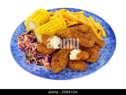 Southern fried chicken dippers, covered in spicy breadcrumbs with French fries and corn on the cob meal isolated on a white background Stock Photo
