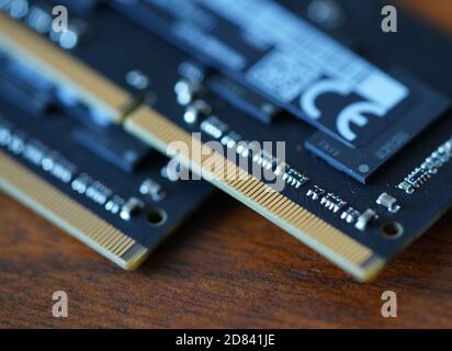 Computer Memory RAM random access memory. High quality photo. Close up shot of microchips on wood table. Stock Photo