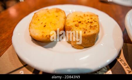 Delicious spaghetti and toast on a white plate Stock Photo