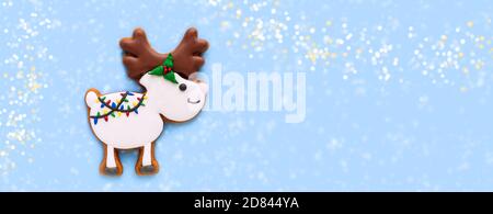 Gingerbread. Cookies in the form of elk or deer. The concept of the celebration. Christmas background, banner. Copy space. Flat lay. Top view. Stock Photo
